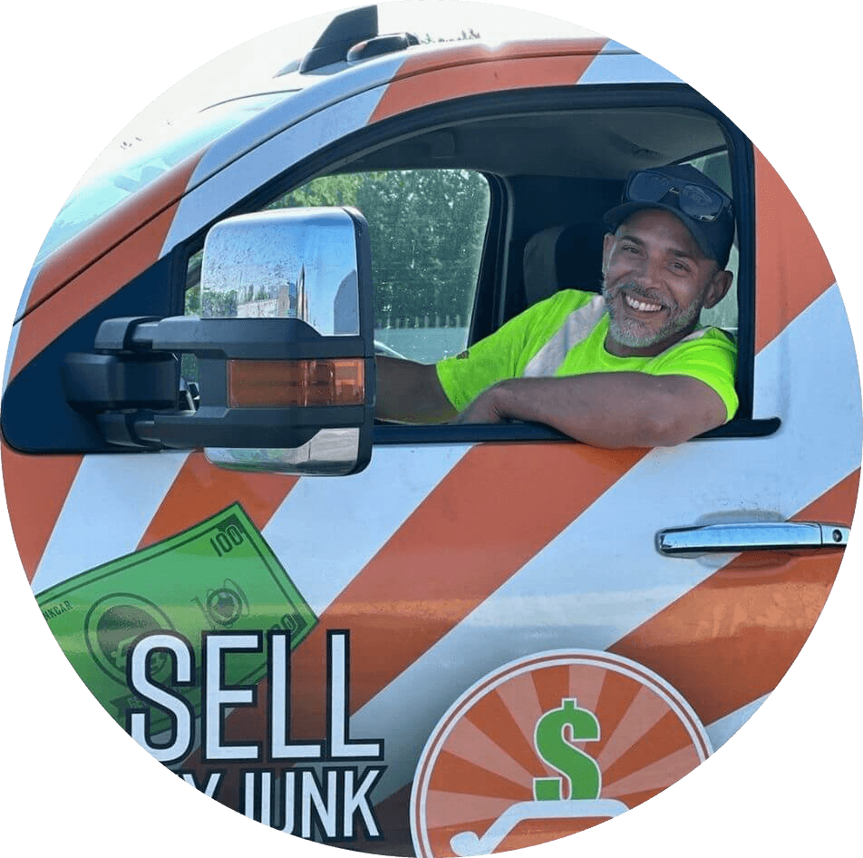 Alfonso, tow truck driver inside his truck.