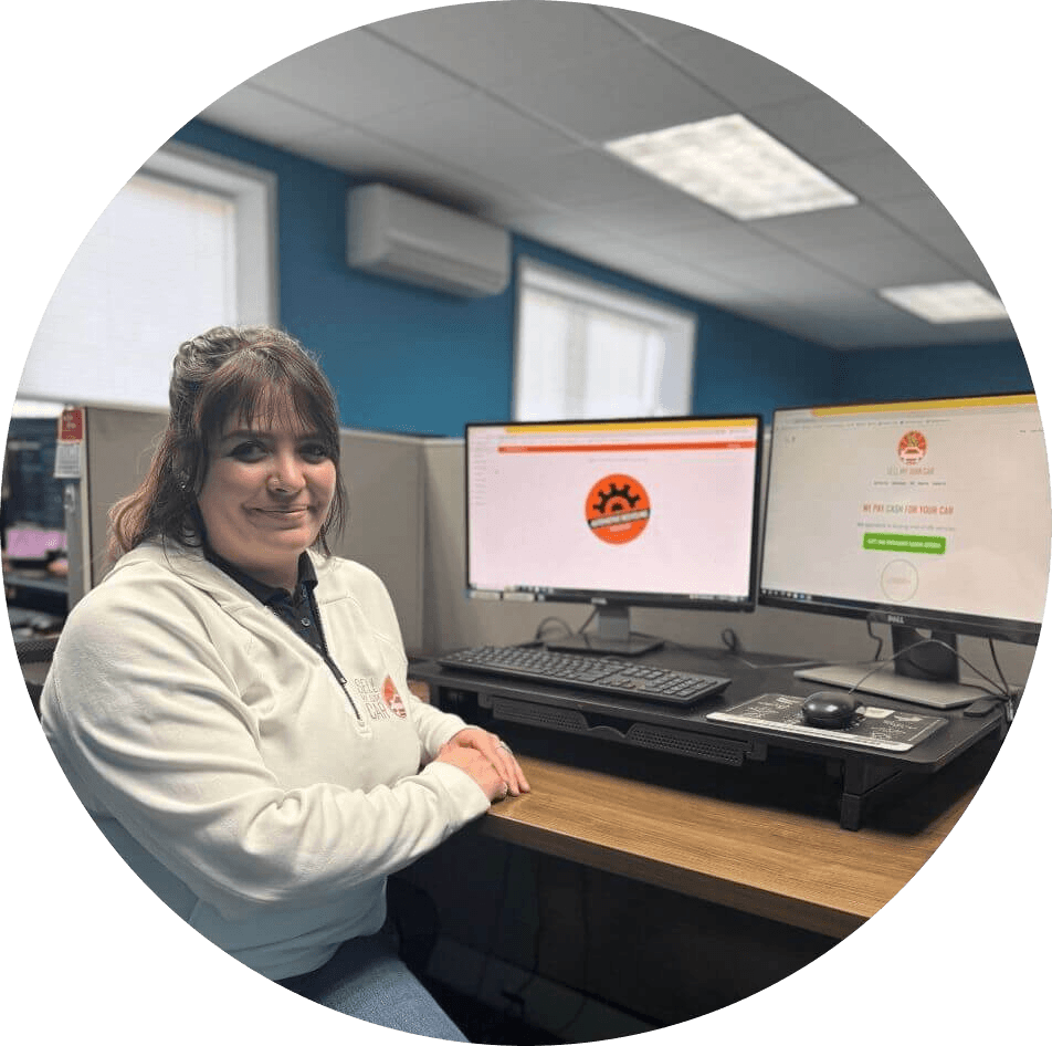 Cassie, vehicle buying manager sitting at her desk