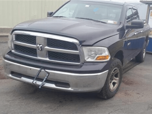 Dark purple Ram 1500 pickup truck with chrome grille and bumpers.
